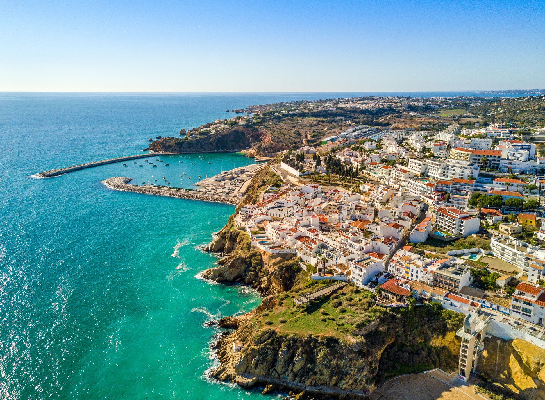 Clifftop town of Albufeira over turquoise water