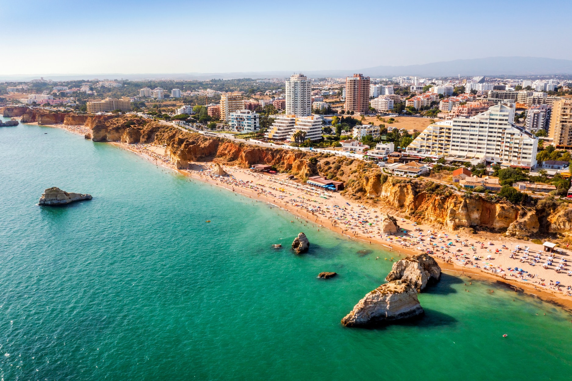 Beachfront of Portimão with orange cliffs
