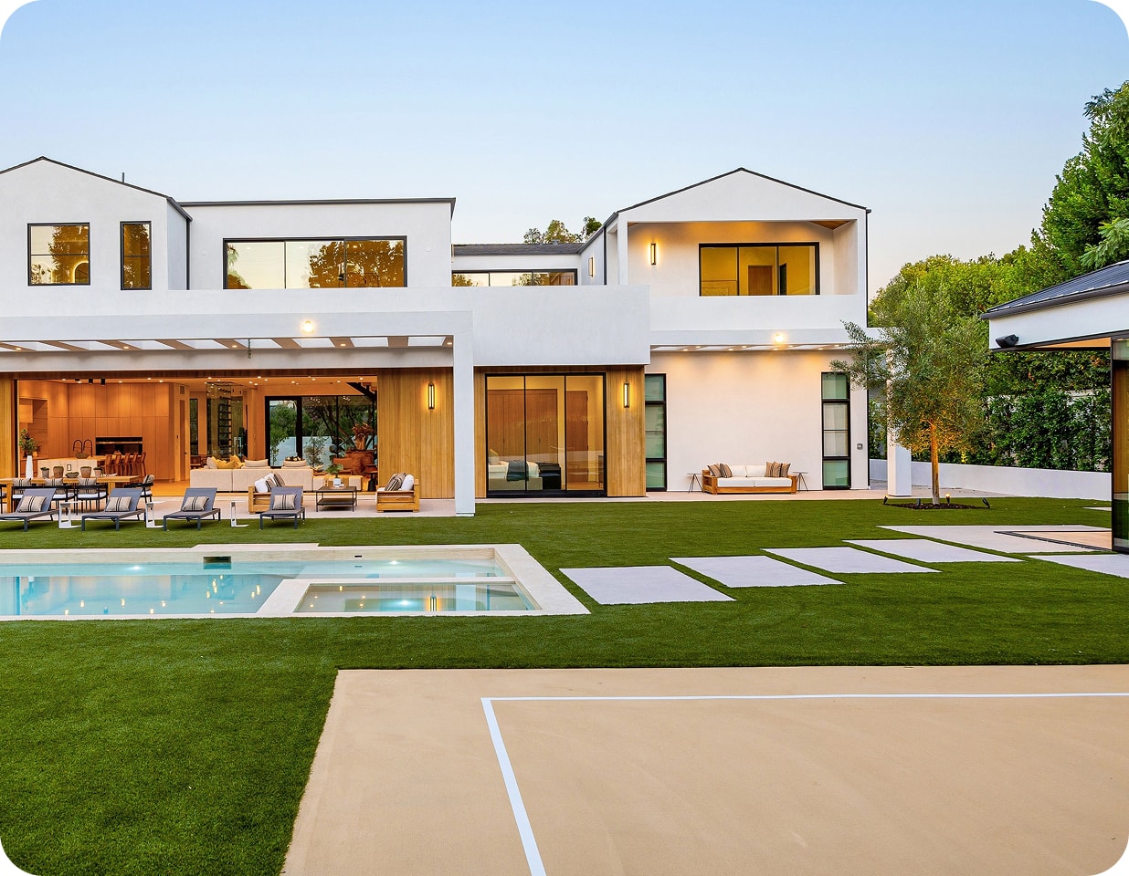 A luxury Algarve villa with a pool at dusk